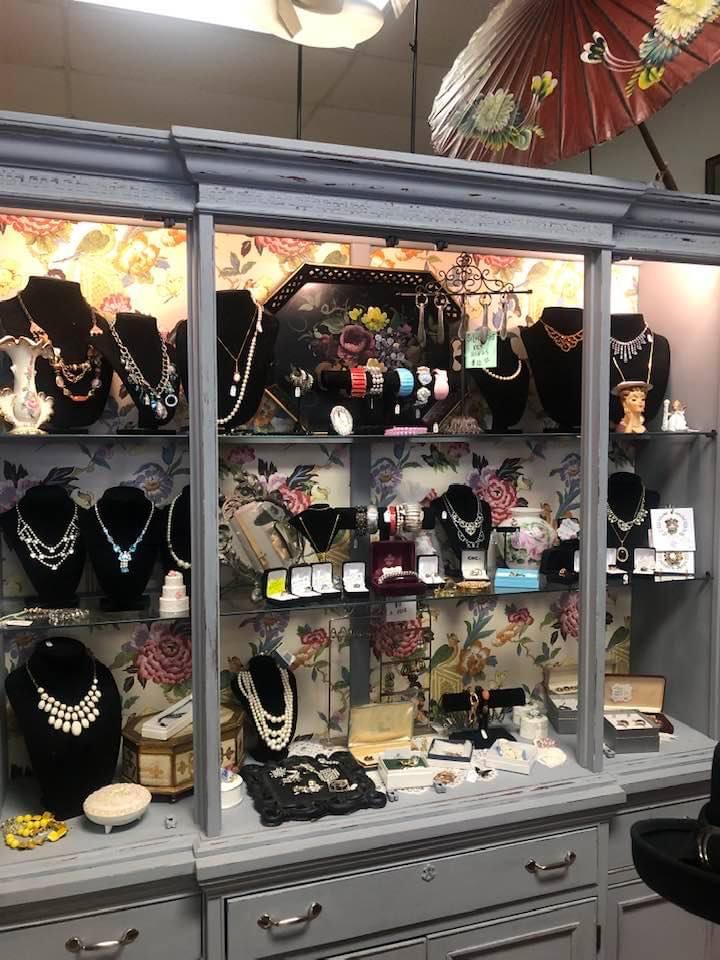 Clear detailed photo of jewelry display with necklaces, bracelets and other items inside